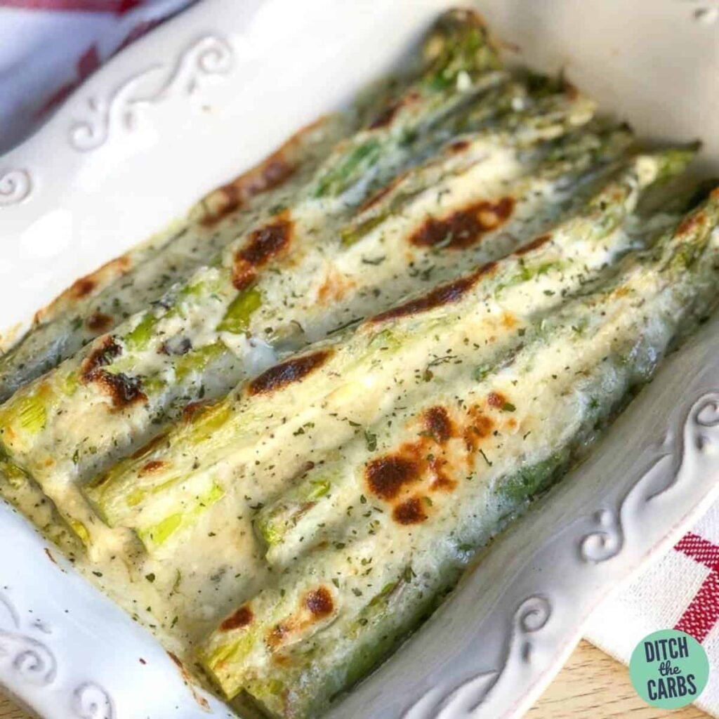 A plate of food with baked asparagus
