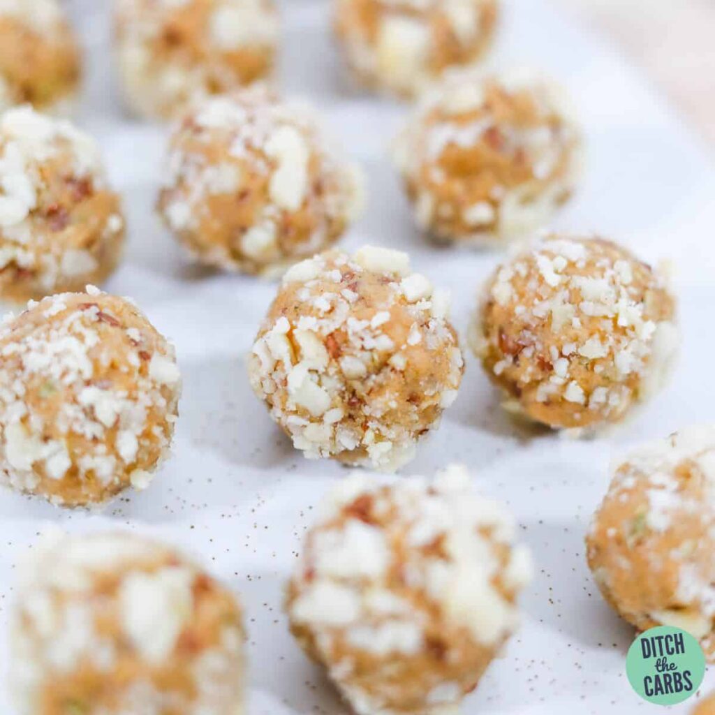Keto protein balls sitting in rows on tray.