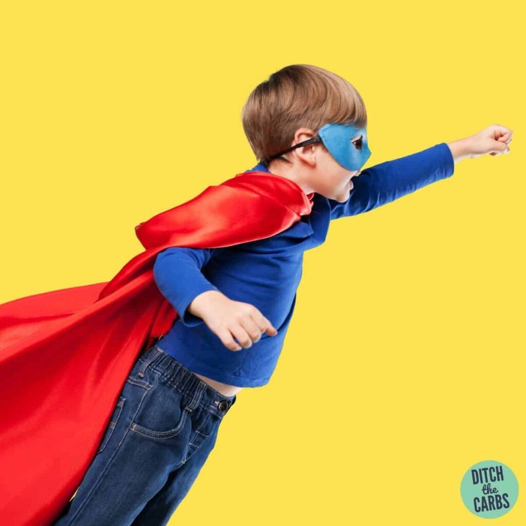 boy with a red cape